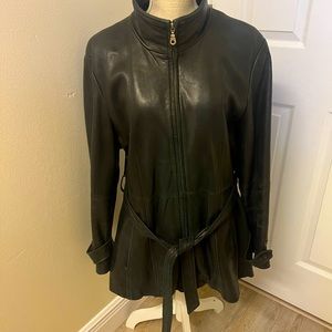 Genuine Leather coat, 3/4 long, with lining. Good condition and fashionable.